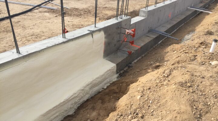 A foundation being built with rebar and concrete