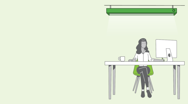 graphical image of a person sitting at a desk under a light working